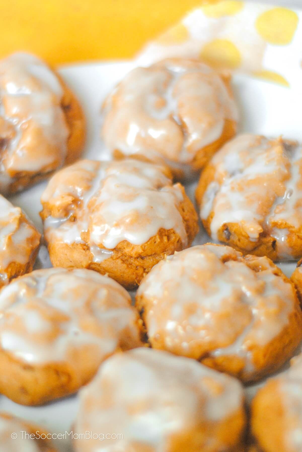 plate of pumpkin cookies with icing