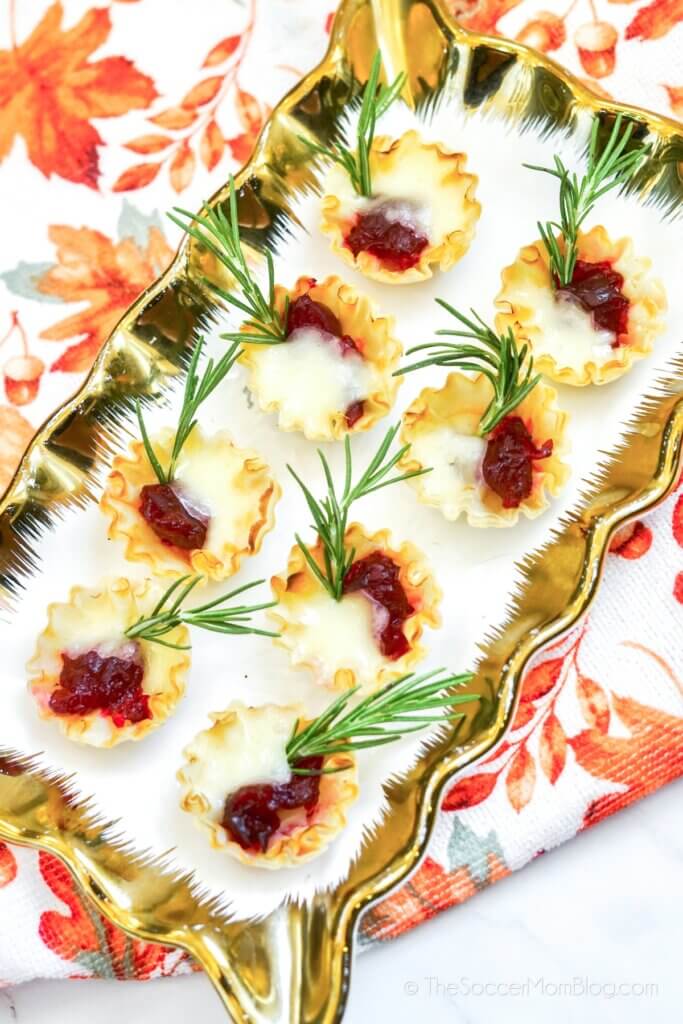 White plate with gold trim and Cranberry Brie Bites