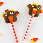 two marshmallows decorated to look like turkeys