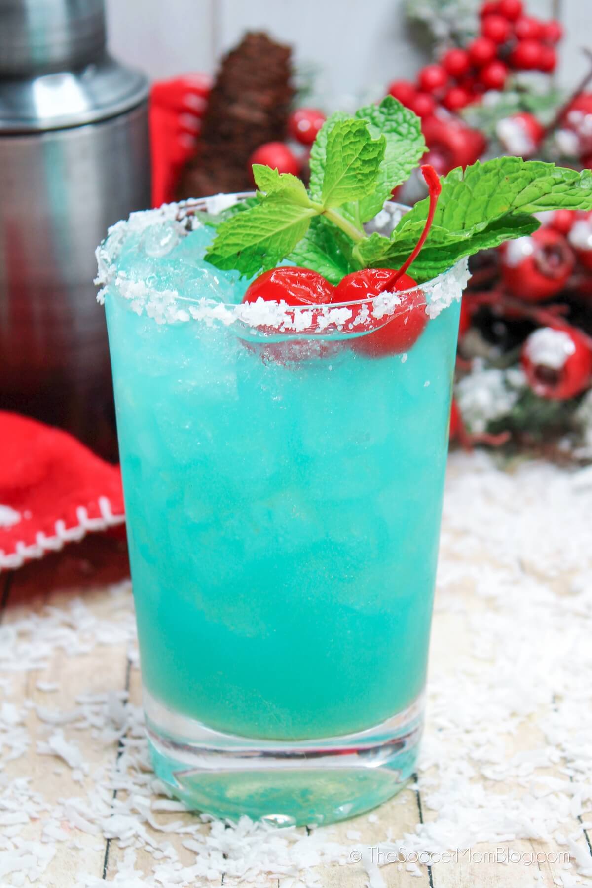 blue cocktail with a sugar rim, with winter background