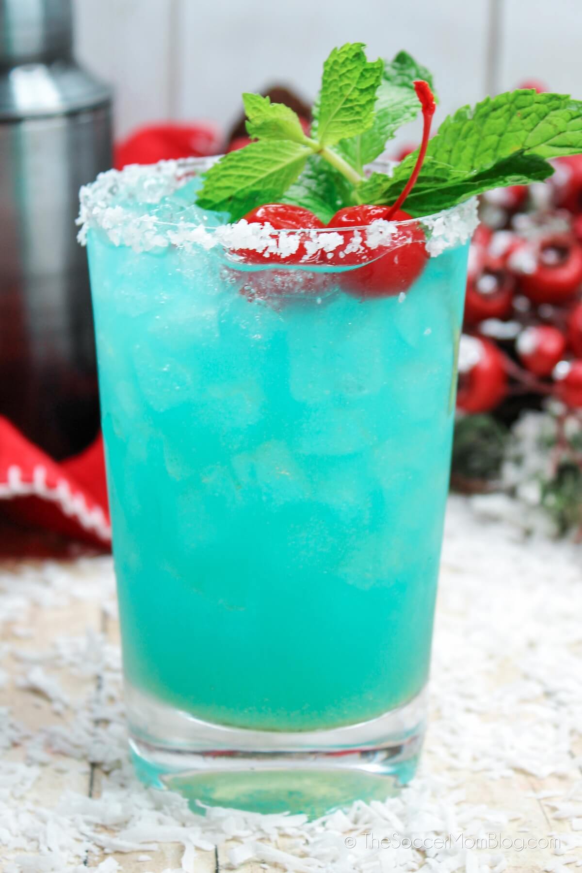 Blue Glacier Cocktail with sugar rim, mint and cherry garnish