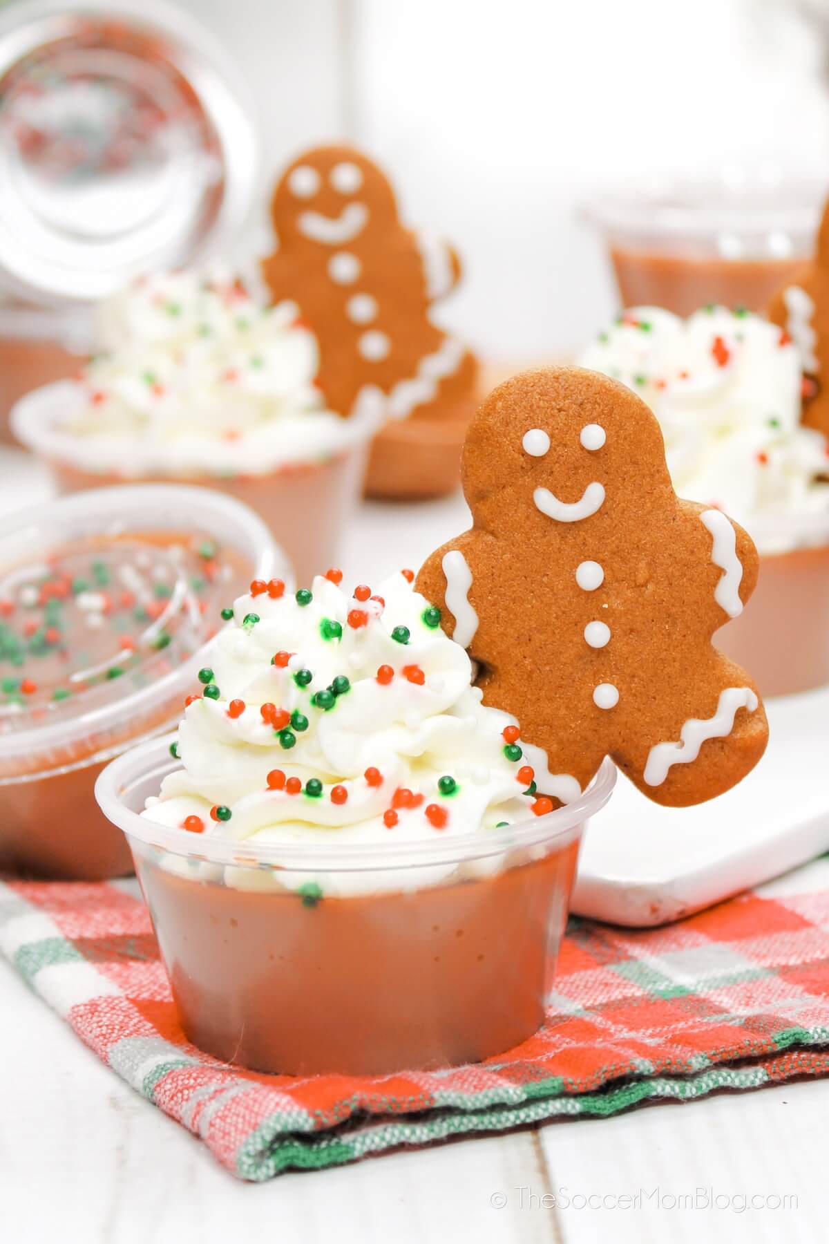 gingerbread jello shots with whipped cream and a cookie on top