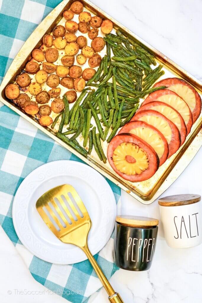 ham dinner on a sheet pan, with potatoes and green beans