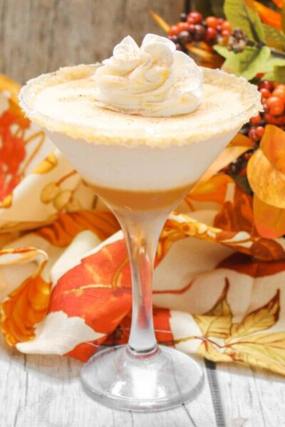 pumpkin pie flavored martini with whipped cream on top