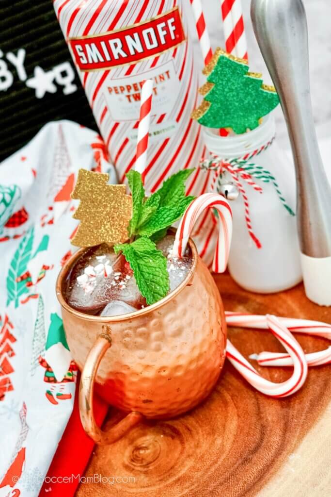 A Christmas version of a Moscow mule, with copper mug and candy canes