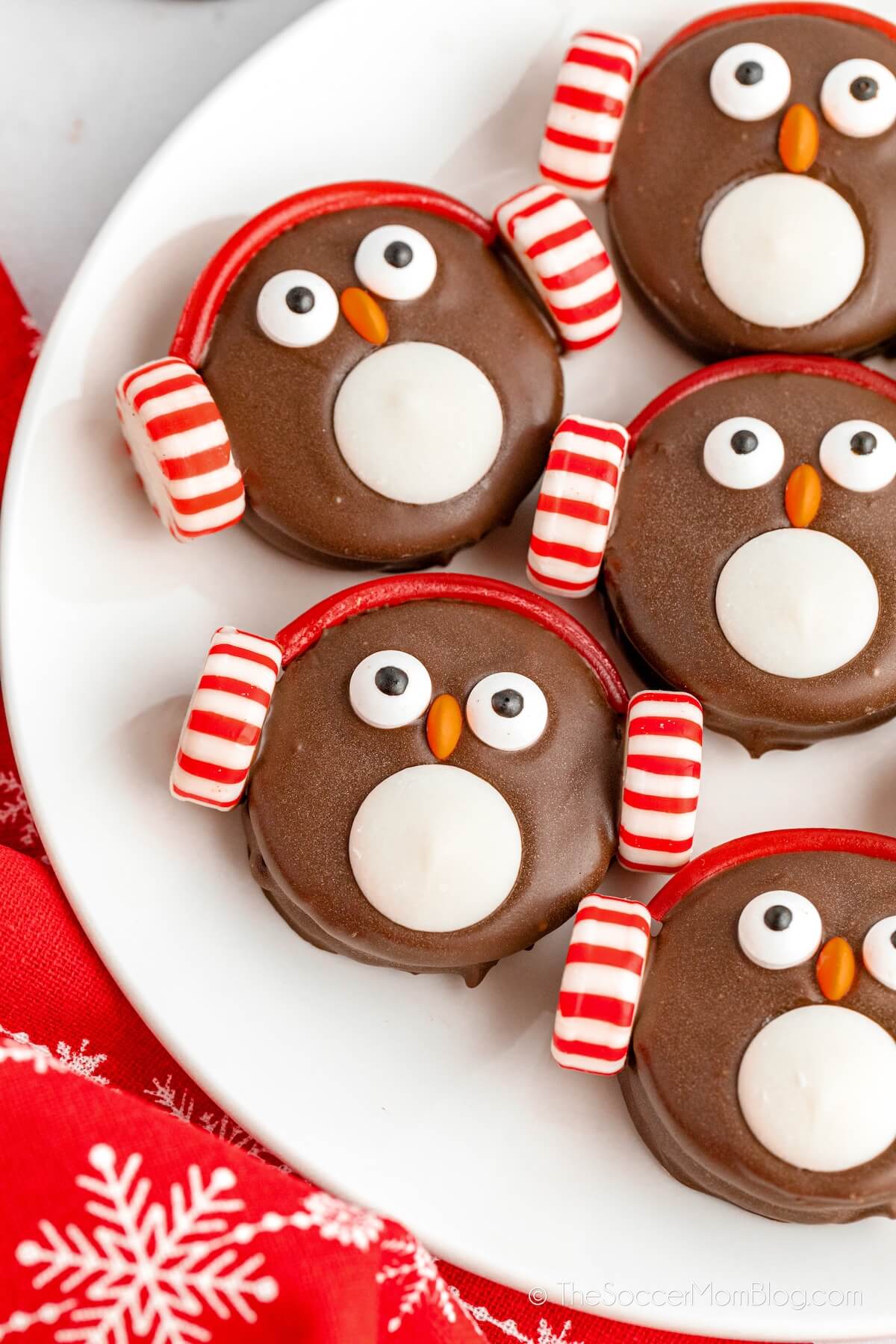 oreo cookies decorated to look like penguin faces