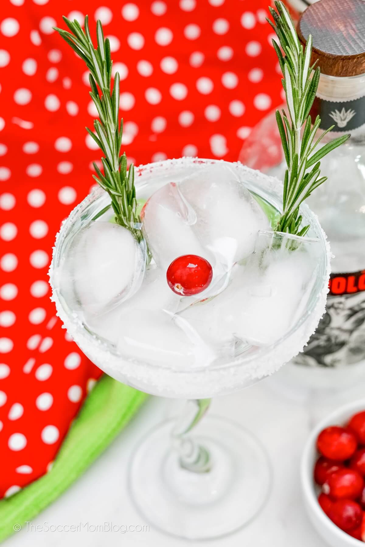 white Christmas margarita, garnished to look like Rudolph's nose and antlers