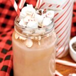 mason jar with spiked hot chocolate, topped with marshmallows