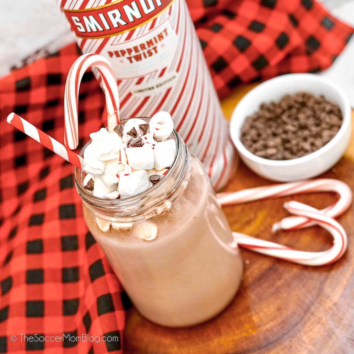 mason jar with hot cocoa, bottle of peppermint vodka