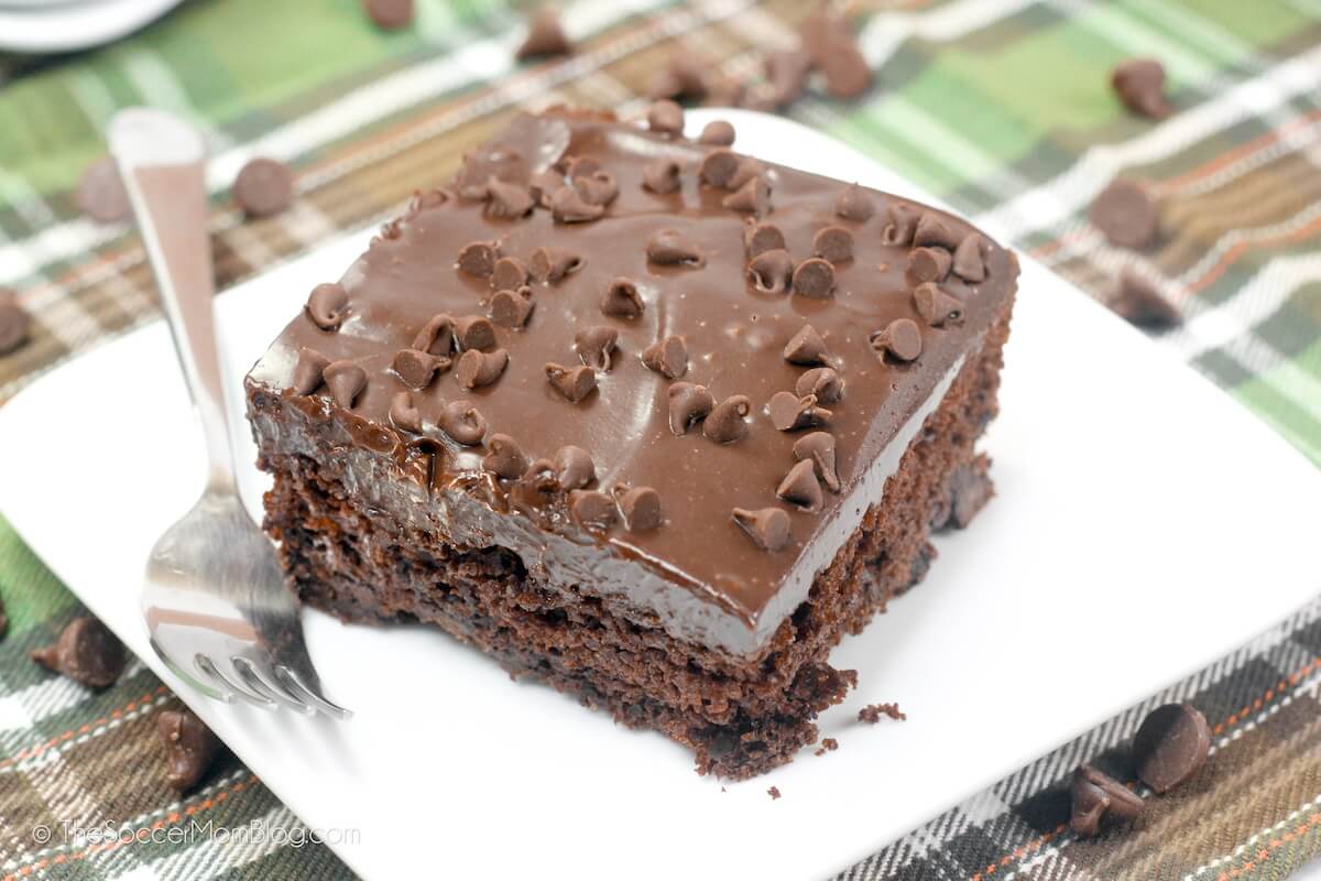 slice of mint chocolate cake with a layer of fudge icing
