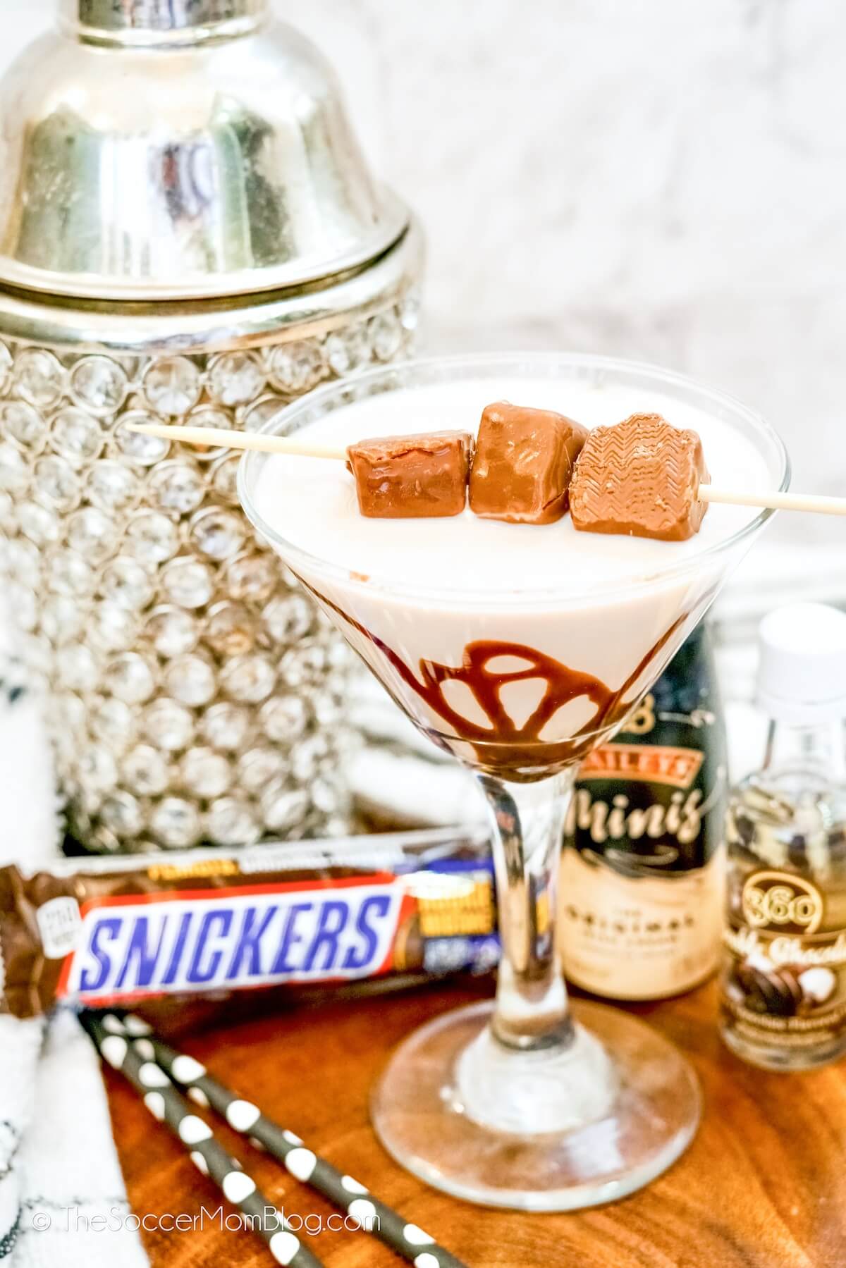 A Snickers Martini, garnished with mini candy bars