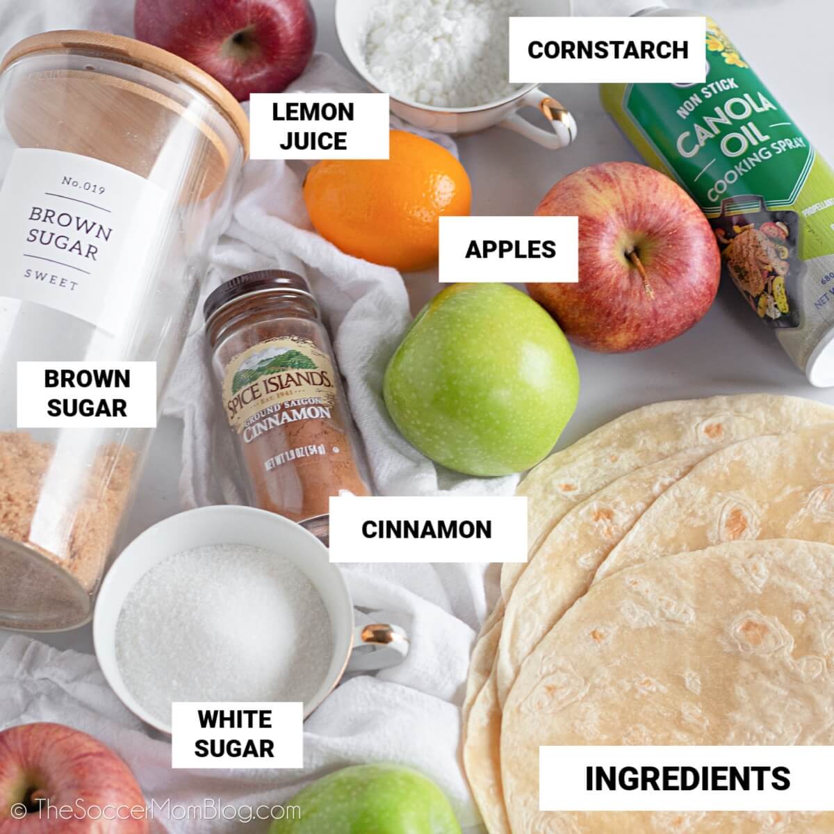 Apple Pie Dip Ingredients, with text labels: Lemon Juice, Cornstarch, Apples, Brown Sugar, White Sugar, Cinnamon