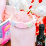 strawberry milkshake in mason jar with conversation heart rim