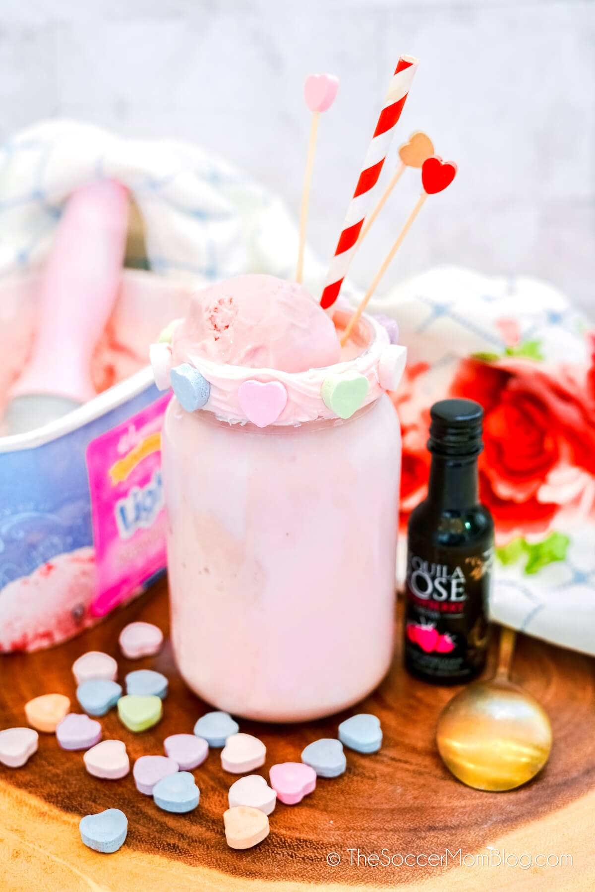 strawberry Valentine milkshake next to ice cream carton and tequila rose bottle