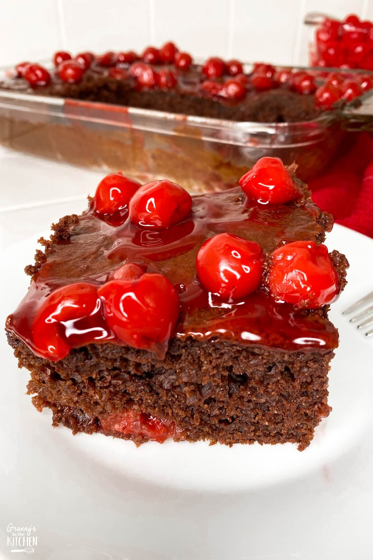 chocolate cake topped with cherry pie filling