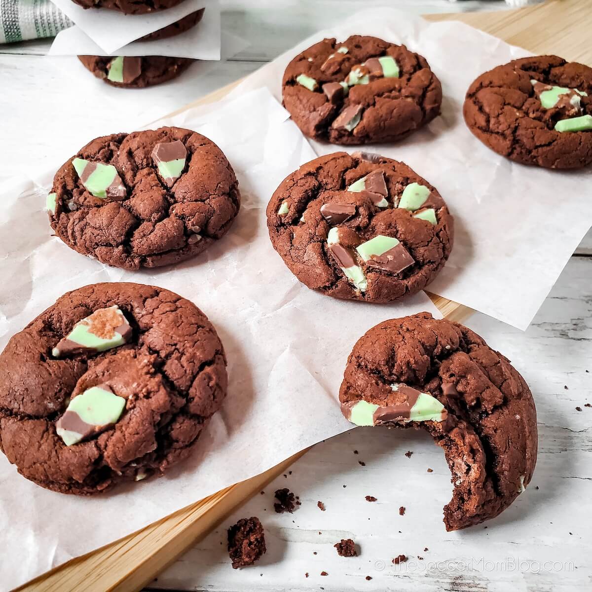 Six Chocolate Mint Chip Cookies on parchment paper