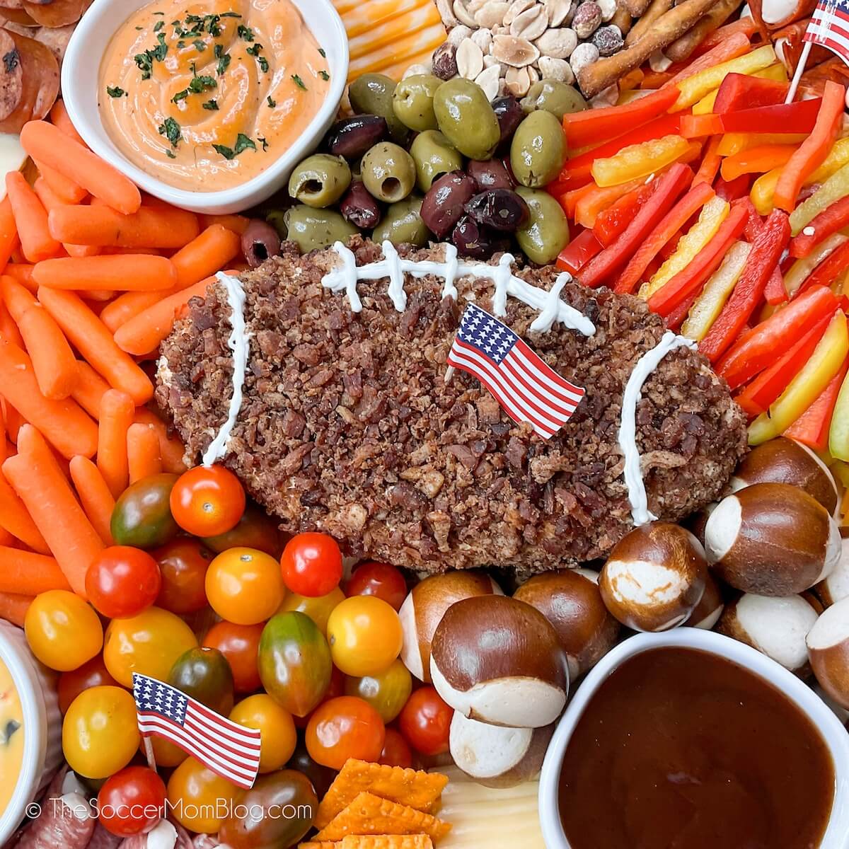 close up of a football cheeseball surrounded by snacks
