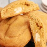 Pumpkin Cheesecake Cookies with one cut in half