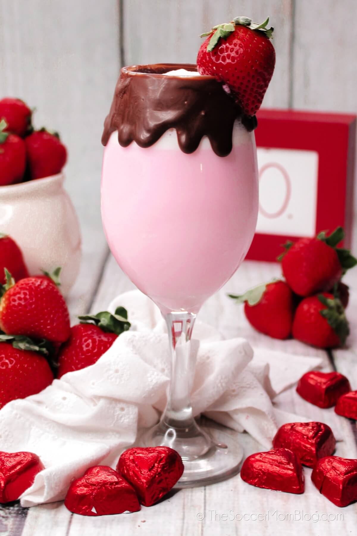strawberries and cream cocktail in a chocolate coated glass