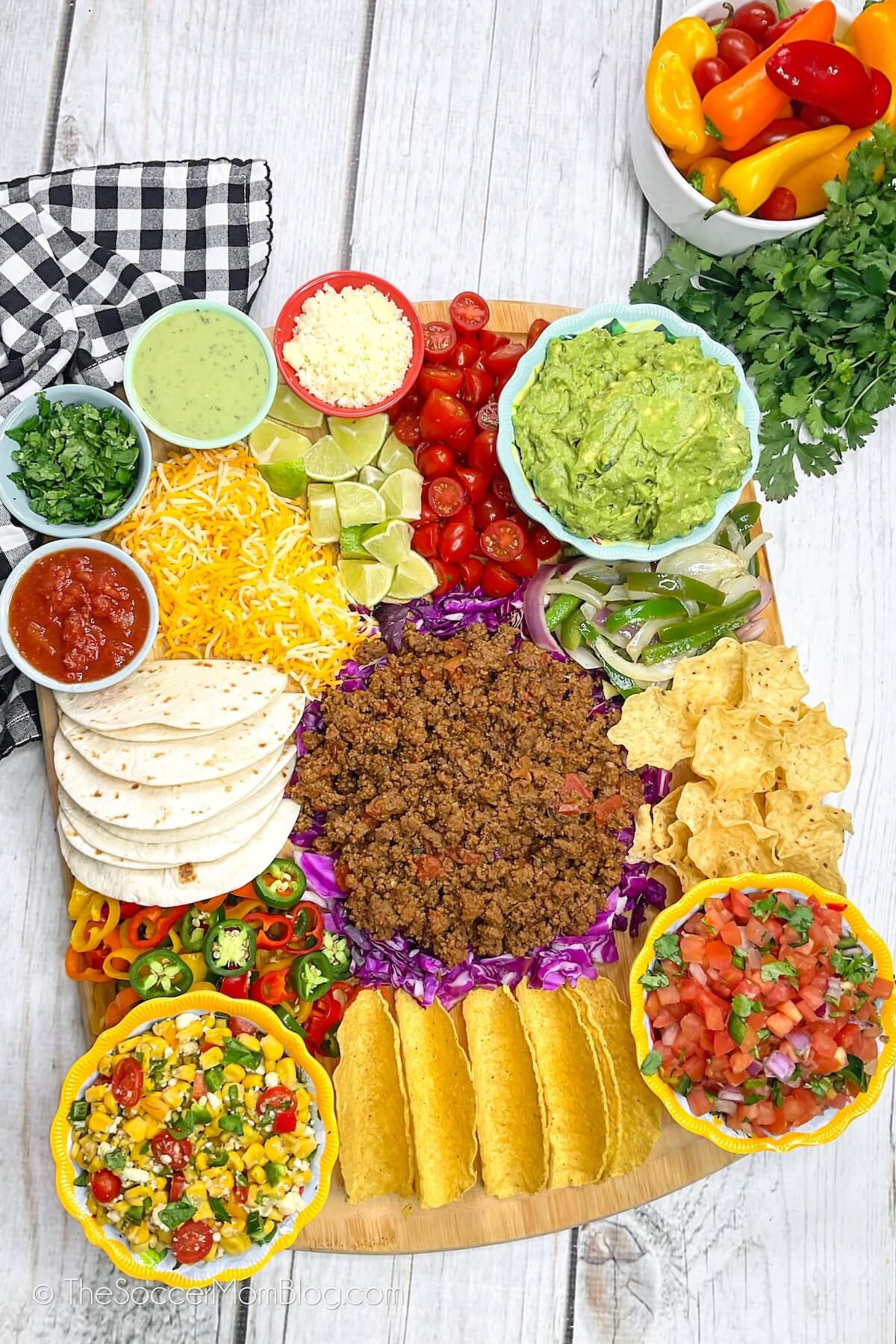 taco charcuterie board with ground beef and fixings