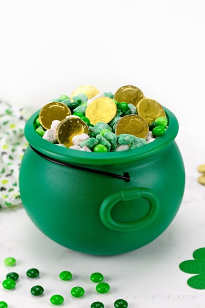 plastic green cauldron with St. Patrick's Day snack mix inside