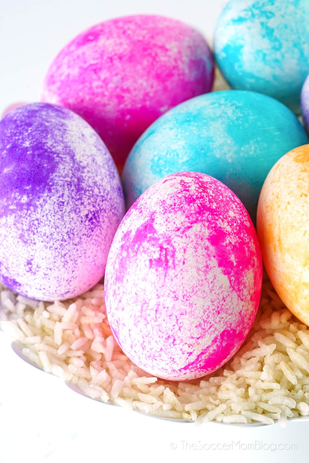 Rice Dyed Easter Eggs in bright colors, on a bed of white rice