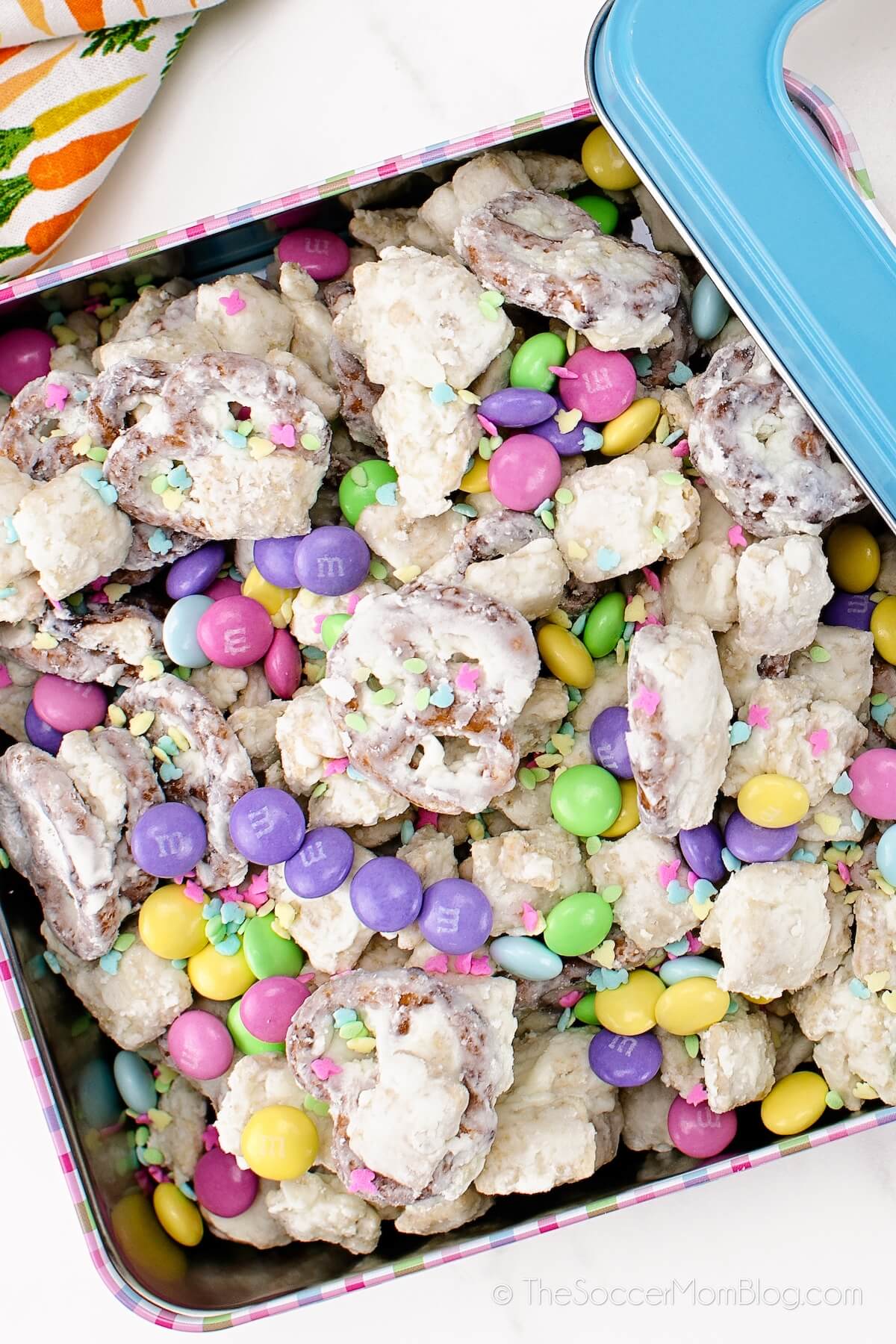 white chocolate Easter snack mix in a decorative tin