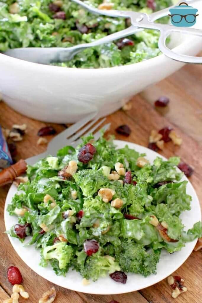 chickfila kale salad on a plate with serving bowl behind it