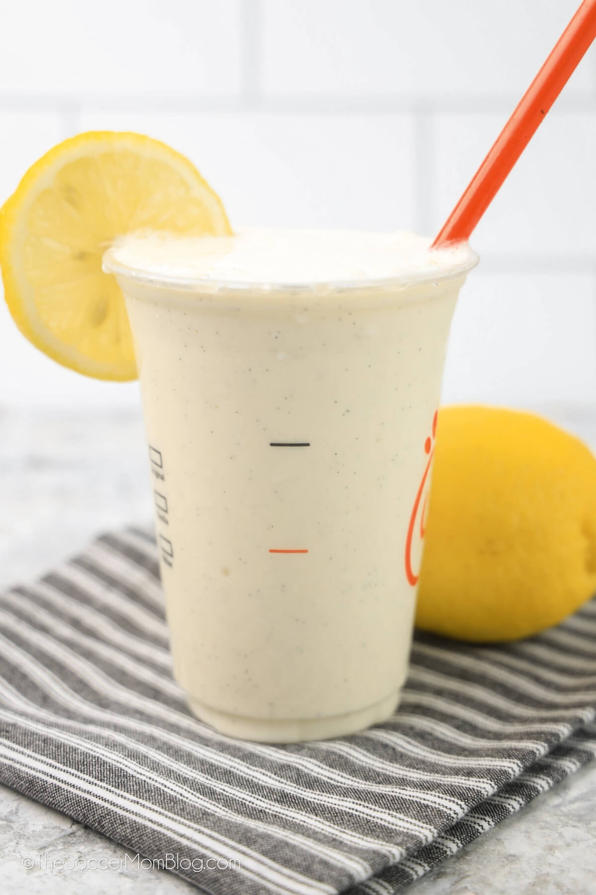 copycat Chick-Fil-A frosted lemonade on countertop with lemons