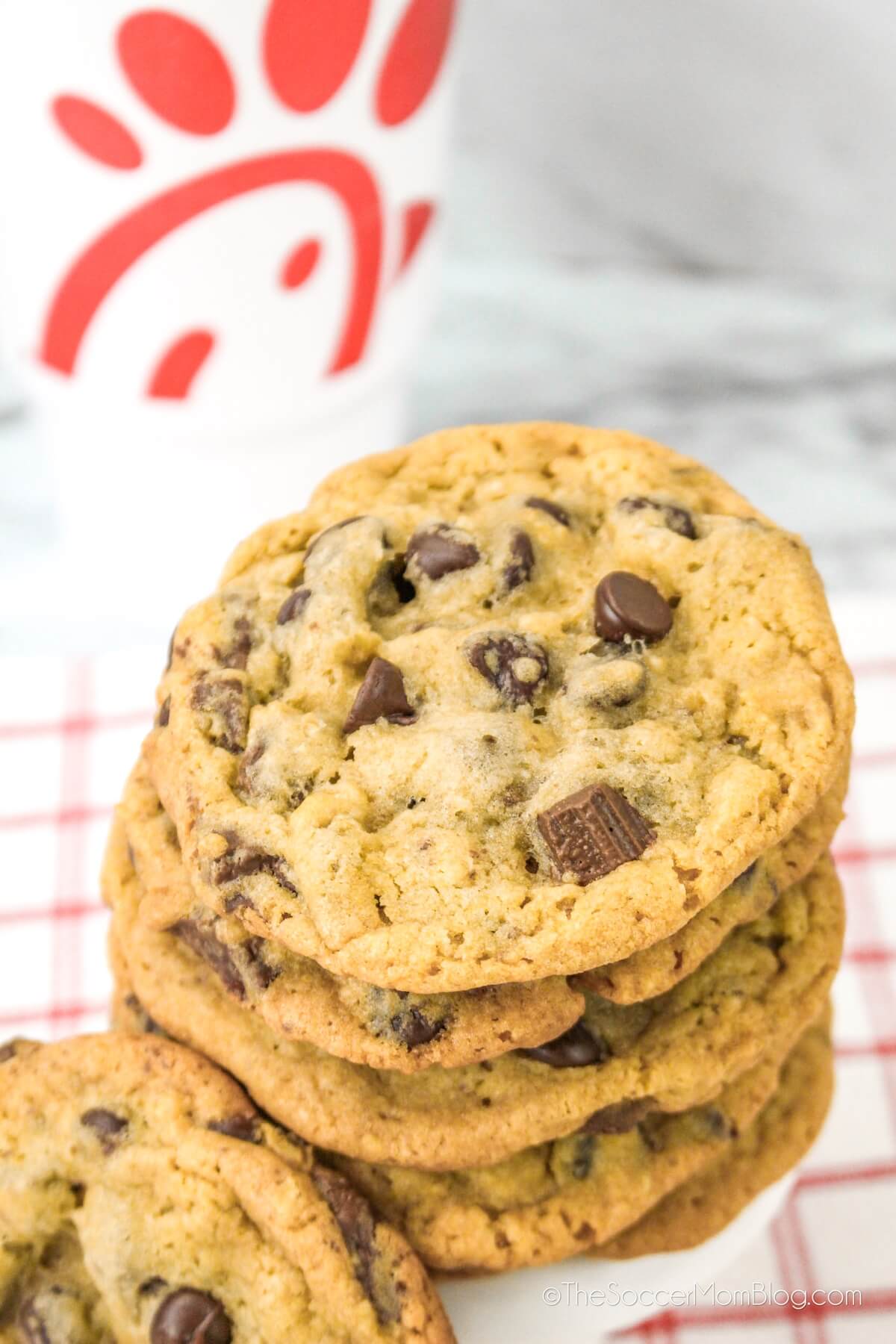 stack of chocolate chip cookies in front of a Chick-fil-A cup