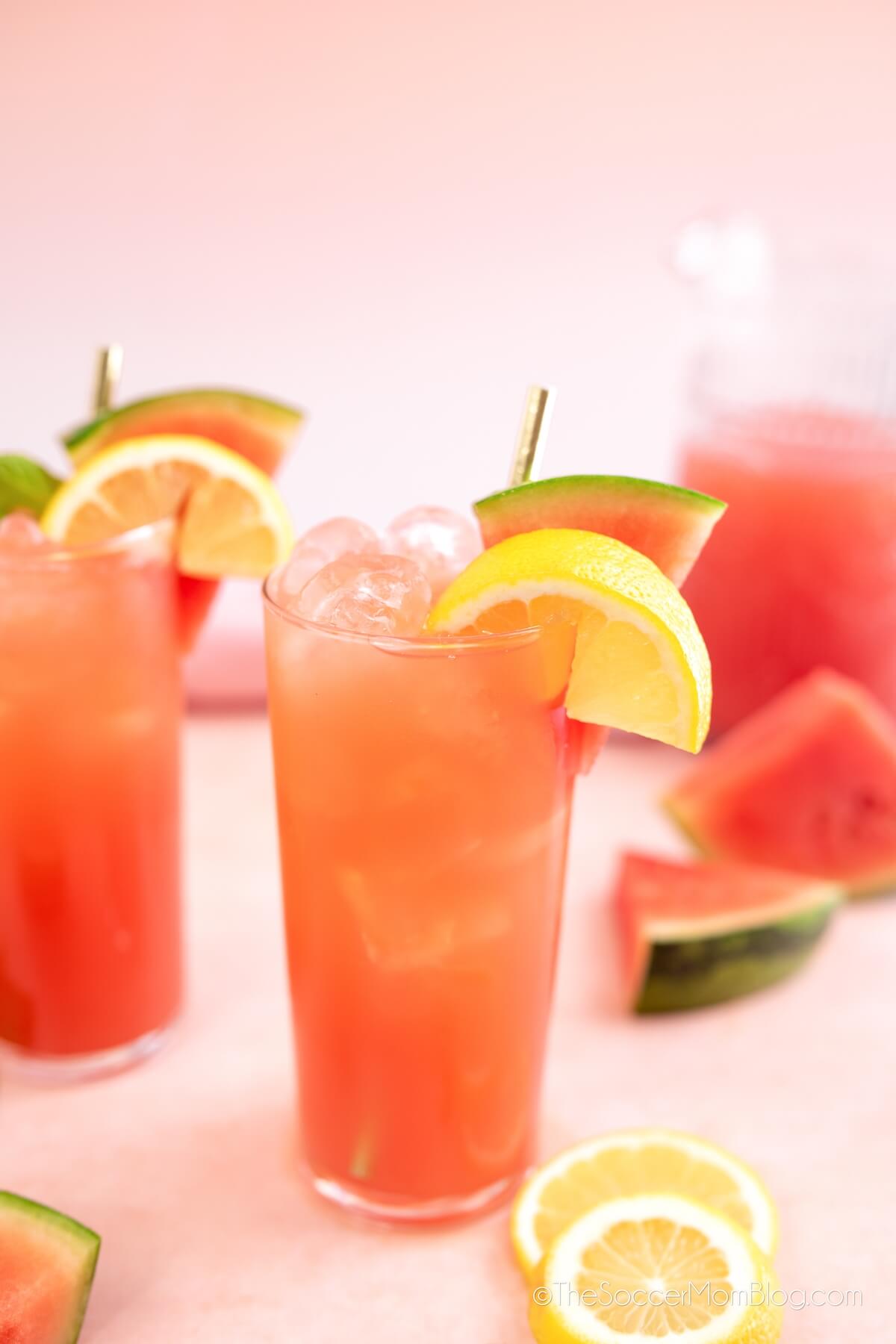 homemade watermelon lemonade in tall glasses, with fresh fruit garnish
