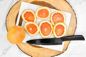 fresh grapefruit slices on a cutting board
