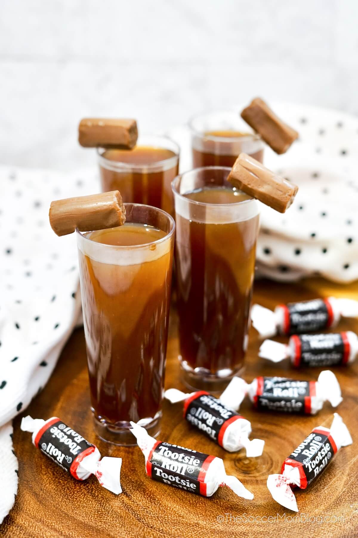 brown Tootsie Roll shots surrounded by Tootsie Roll candies