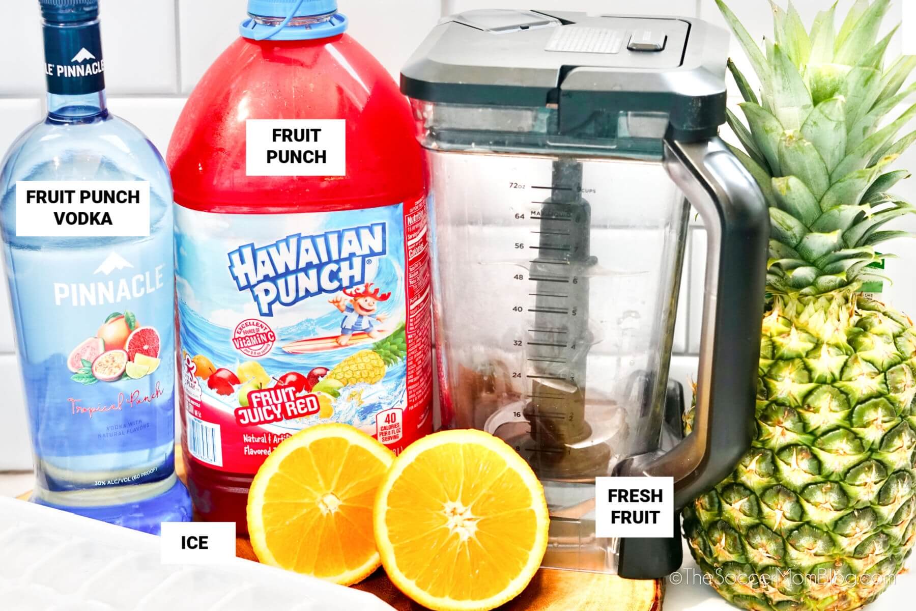 ingredients to make frozen Hawaiian punch, with labels: fruit punch vodka, fruit punch, ice, fresh fruit