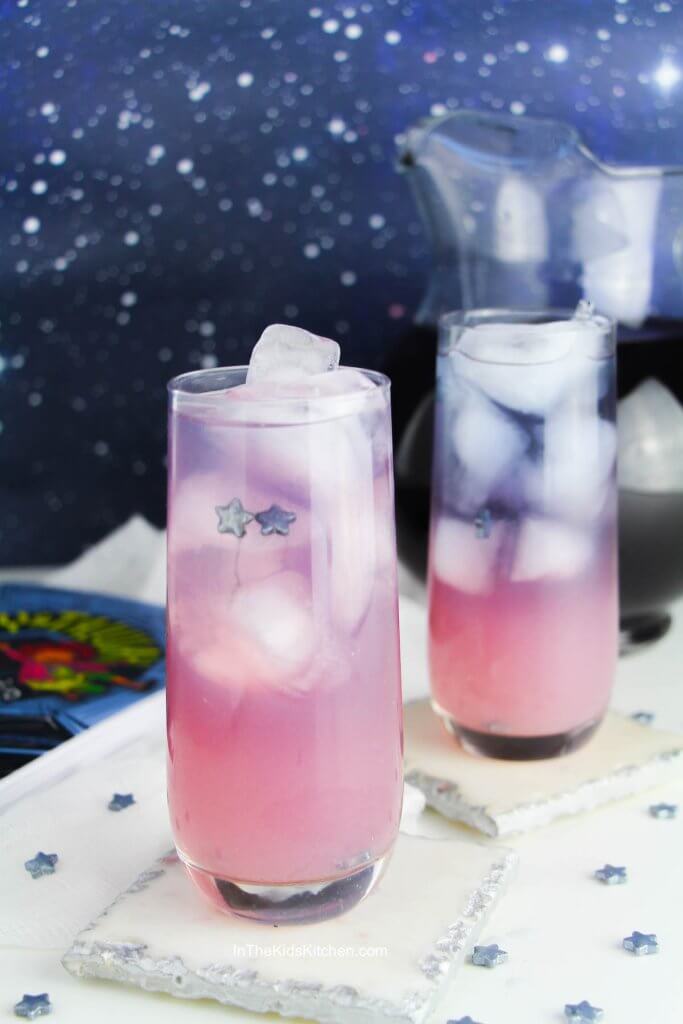 two glasses of galaxy lemonade that are pink and purple in color
