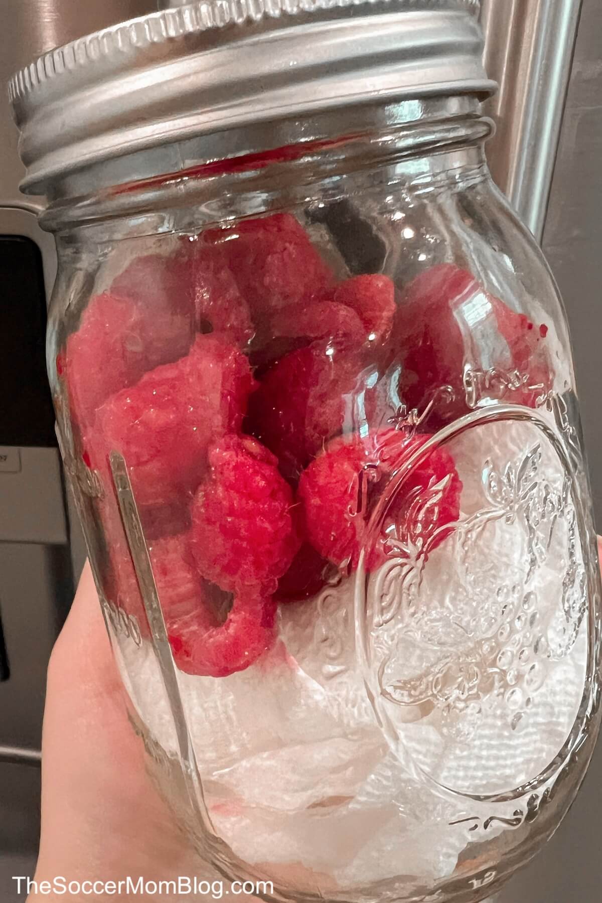 raspberries in a mason jar