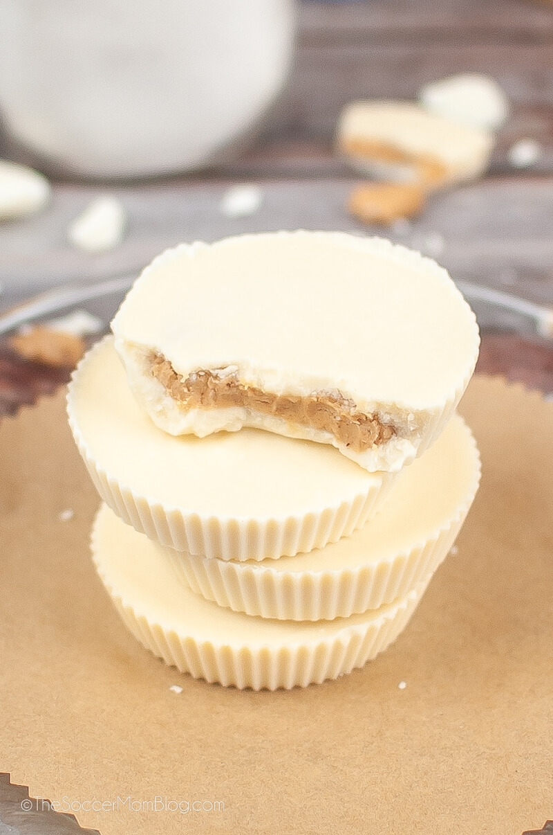 Reese's White Chocolate Peanut Butter Cups sitting on parchment paper