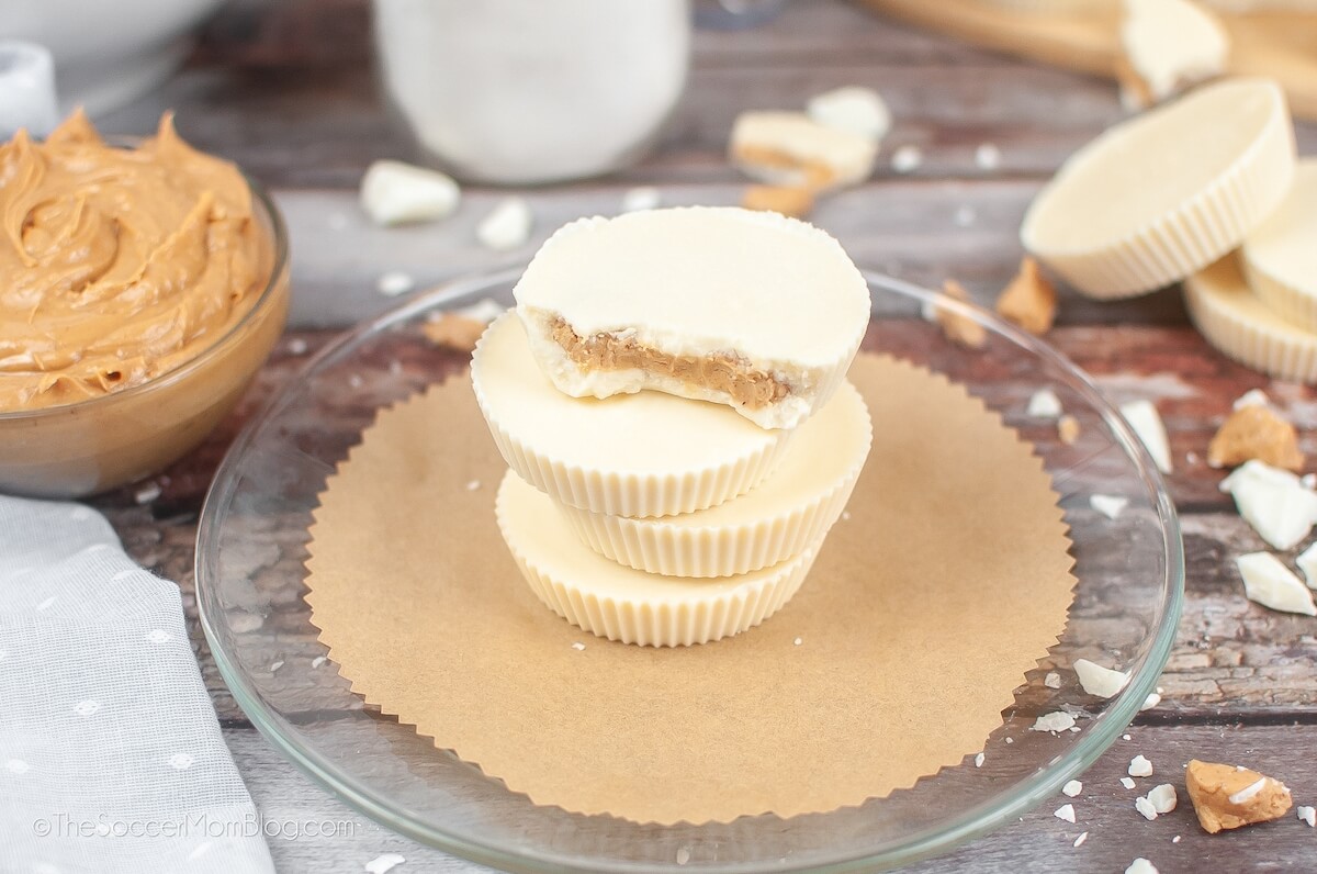 plate of White Chocolate Peanut Butter Cups, with a dish of peanut butter on the side