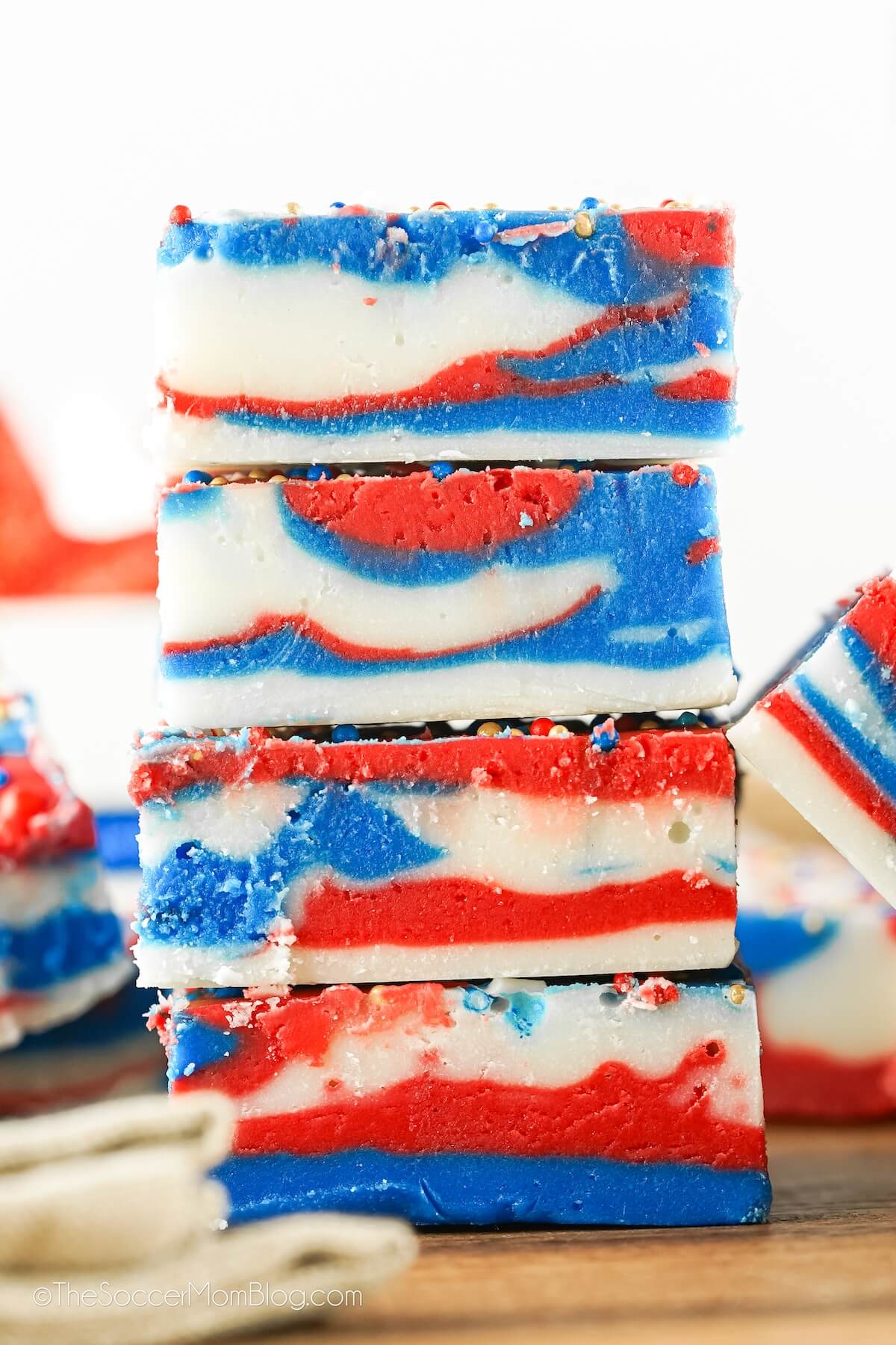 stack of 4 red, white, and blue swirled fudge pieces - with white background