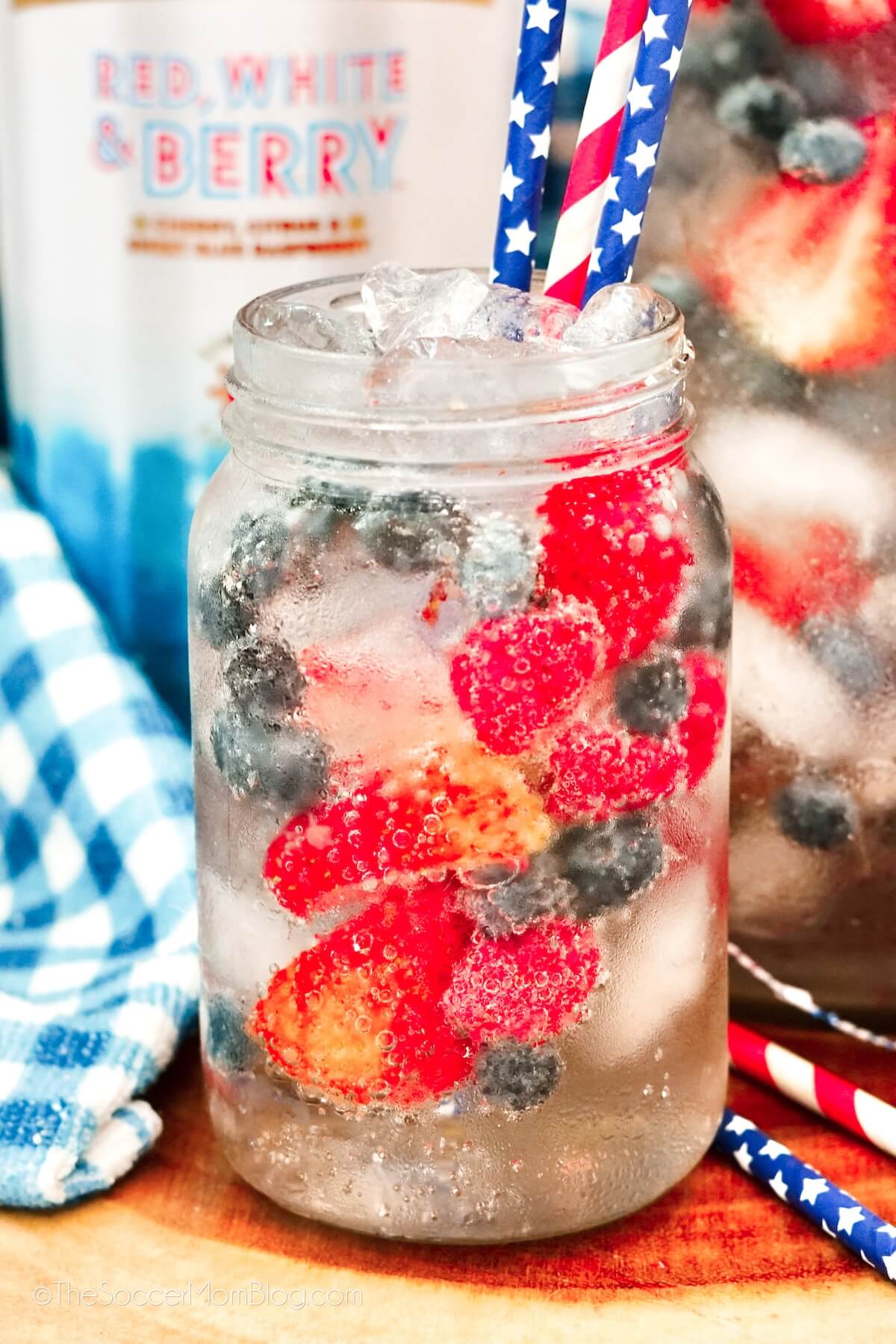 mason jar with soda and fresh berries