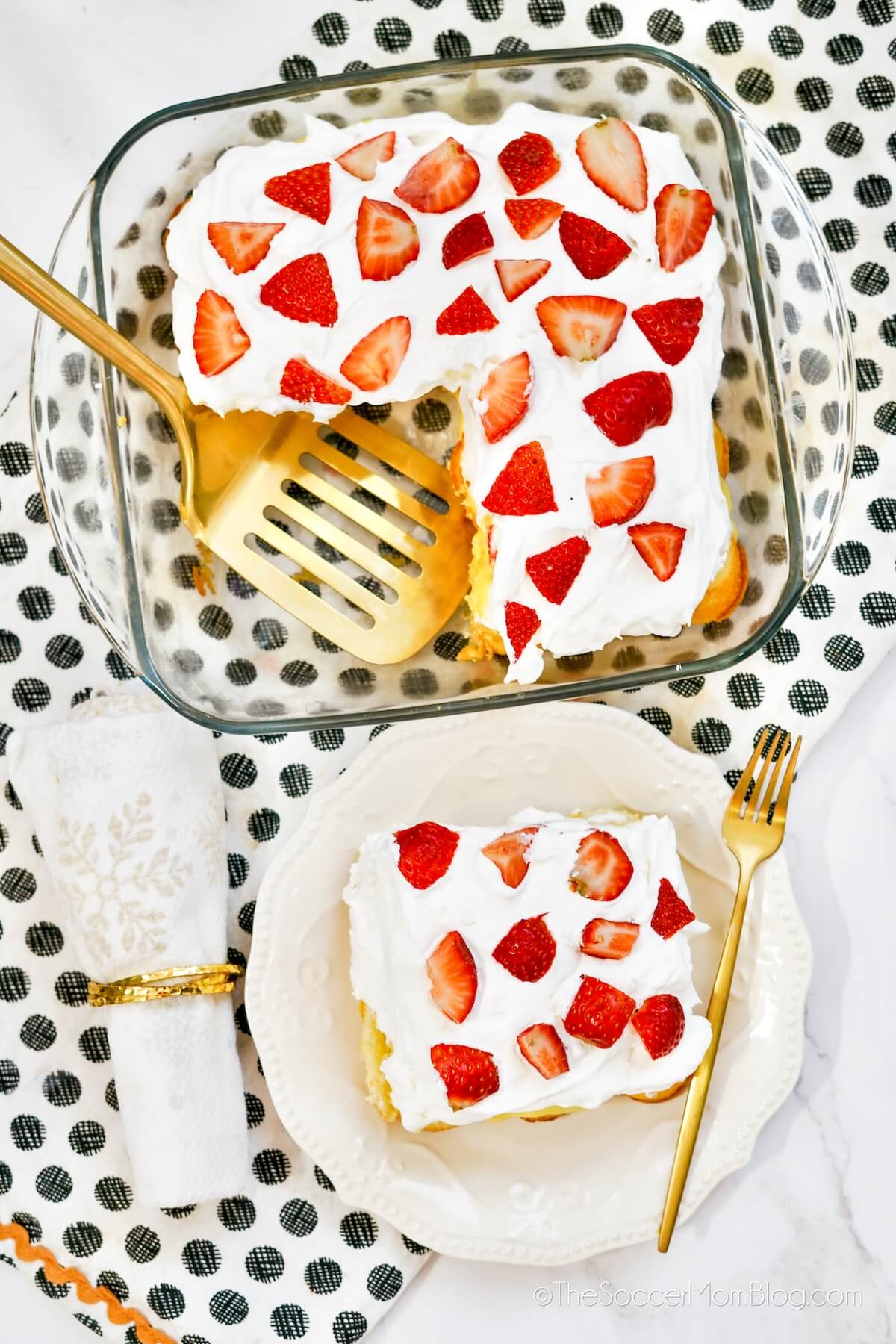 a Strawberry Twinkie Cake in glass dish and a slice on a plate