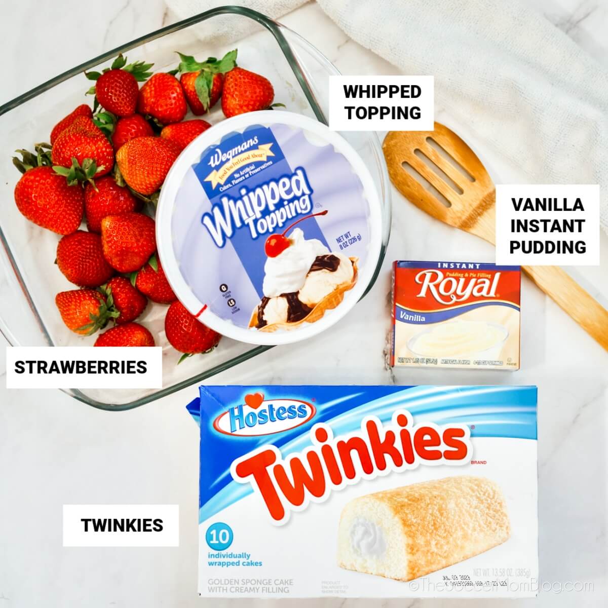 Strawberry Twinkie Cake ingredients: whipped topping, strawberries, vanilla instant pudding, Twinkies