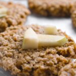 close up of oatmeal cookies with apple chunks on top