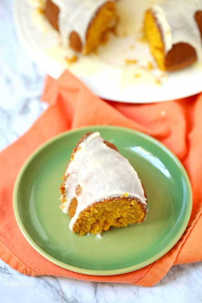 Cake Mix Pumpkin Bundt Cake, one slice on a plate and full cake in background