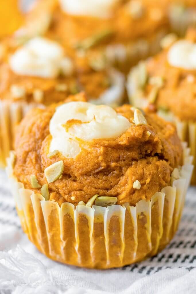 close up of a pumpkin muffin with cream cheese filling