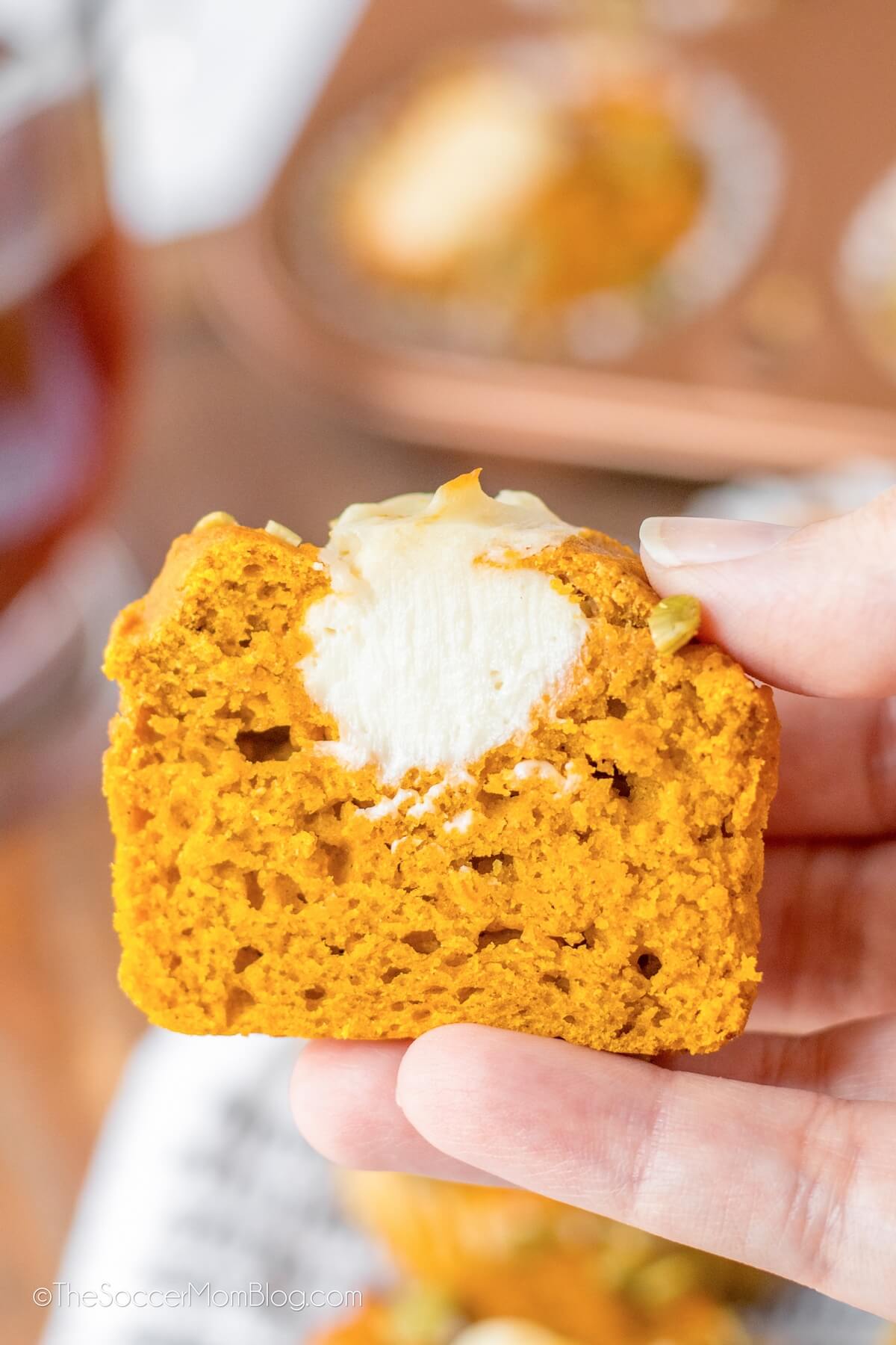 copycat Starbucks pumpkin muffin cut in half to show cream cheese filling
