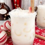 Christmas White Russian, garnished with peppermint sticks.