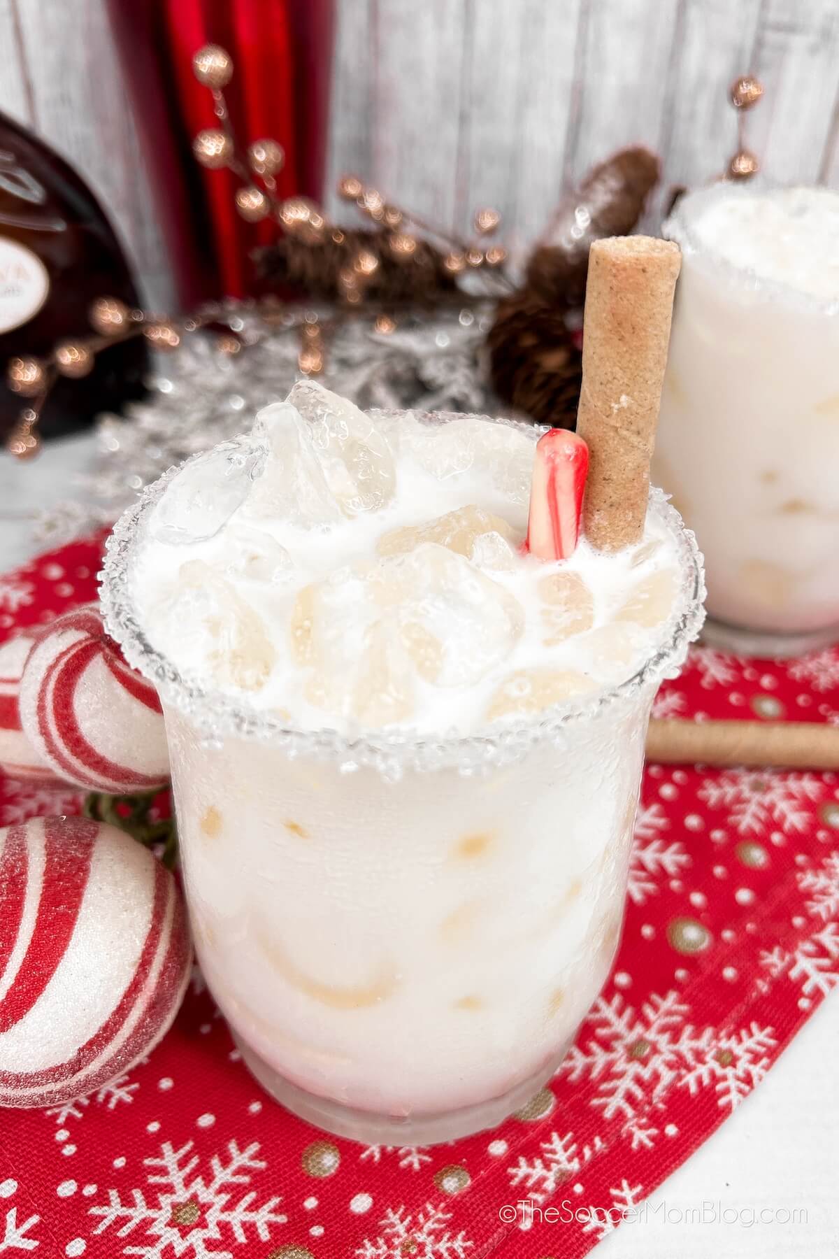 Christmas White Russian, surrounded by candy cane striped ornament balls.