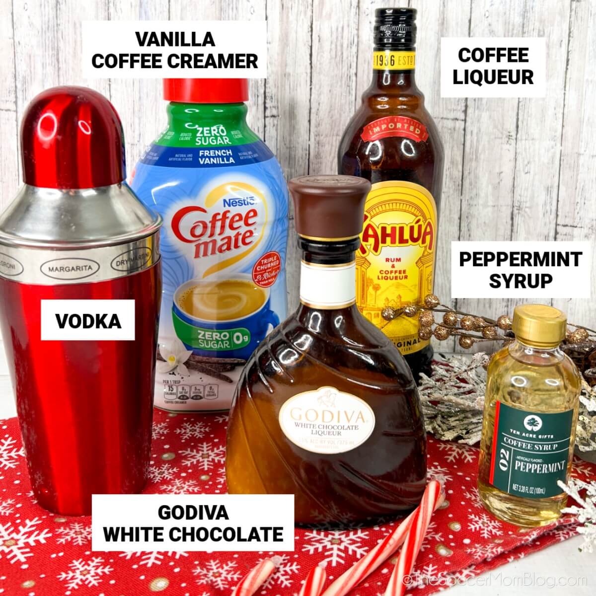 Christmas White Russian ingredients: vodka, vanilla coffee creamer, coffee liqueur, peppermint syrup, Godiva white chocolate.