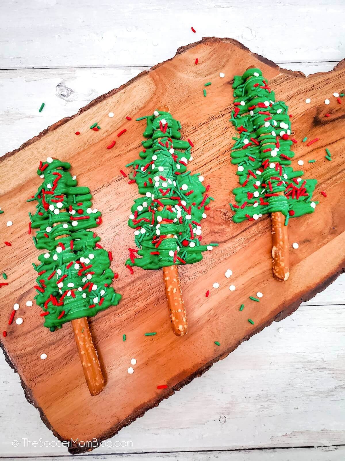 pretzel rods covered in melted green chocolate to look like Christmas trees.